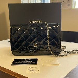 Chanel classic black patent leather quilted mini bag.